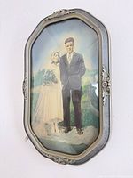 Full view of framed colourized wedding photograph