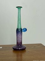 Full view of stovepipe vase on table