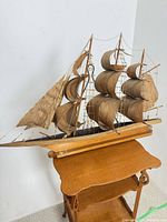 full view starboard side of wooden sailboat model on stand
