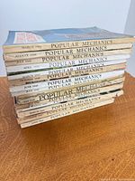 Stack of magazines showing spines with dates 1944-1955