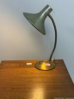 Lamp lit on table showing full profile