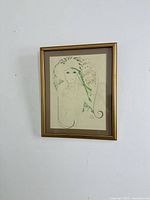 Full view of framed lithograph on wall