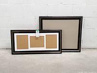 Both frames front view against wall