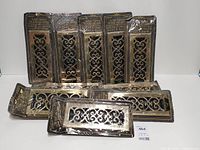all ten packaged brass floor registers displayed