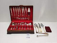 Overall lot with chest open and additional utensils displayed