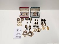 Overview of all earrings including boxed and loose pairs