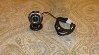 Front view of Microsoft LifeCam VX-3000 webcam with attached USB cable