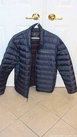 Front view of Eddie Bauer puffer jacket on hanger