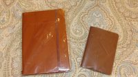 Journal and passport holder side by side showing size and matching color