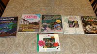 All six gardening books laid out on table