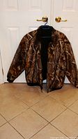 Front view of Remington camouflage jacket on hanger