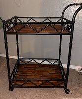 Full view of two-tier metal bamboo rolling cart