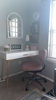 Overall view showing desk, chair, mirror, clock, wall organizer and accessories