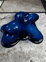 Top view of Blenko Persian Blue freeform ashtray showing overall shape and gloss finish