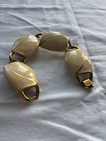 Bracelet laid out showing enamel panels and clasp