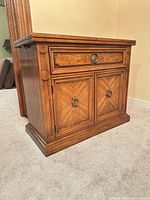 Front view showing drawer, cabinet doors, hardware and wood grain