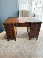 Front angled view showing drawers and hardware