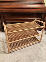 Front angled view showing three slatted shelves and overall structure