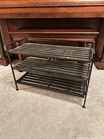 Front view of three-tier metal shoe rack