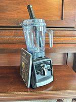 Front view of Vitamix A2500 assembled with cookbook