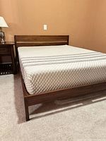 Walnut bed frame with Leesa mattress side view