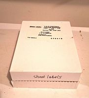 Closed white box labeled sheet labels