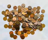 Large pile of mixed U.S. and Canadian one-cent coins