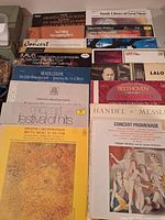 Group shot showing majority of the 16 classical LPs with visible titles and composers