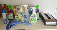 Shelf with various cleaning bottles, mop tool and bag holder