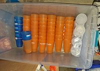 overview of tote with stacked orange tumblers and blue tumblers
