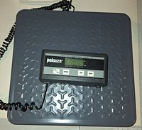 Top view of gray steel platform with attached LCD control panel