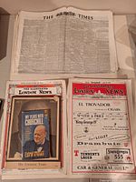 Stack of Times newspapers plus three Churchill related magazines displayed on table
