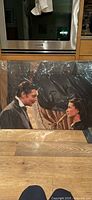Front view of sealed lifesize cardboard cutout featuring Rhett Butler and Scarlett O’Hara