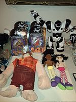 Lot overview: robot, plush Wreck-It Ralph, two Groovy Girls dolls, four Warriors of Virtue figures in packaging