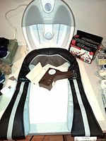 All four items grouped: Conair foot spa, TruMedic massager, Press-O-Test BP device, Bally exerciser packaging partially visible