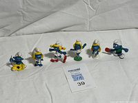 All six Smurf figurines lined up