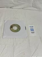 Vinyl single in sleeve with lot card