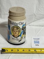 Front view showing Bobby Orr portrait, signature, text and lid