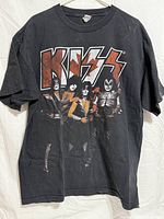 Front view of T-shirt showing KISS logo and band members
