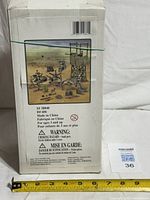 Back of boxed playset showing contents illustration, SKU and warning text