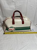 Front view showing Labatt 50 logo, handles, and measuring tape for scale