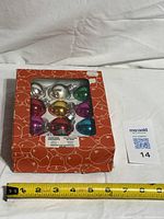 Front view of boxed set with measuring tape for scale