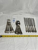 Full set of forks, spoons, knives with measuring tape