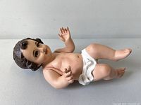 Front angled view of entire baby Jesus figure