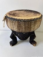 overall view of three-footed drum table