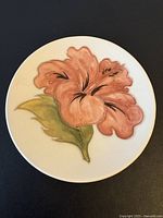 Front of Moorcroft Hibiscus pin dish showing floral decoration