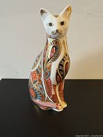 Front view of Royal Crown Derby Siamese cat figurine