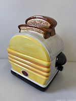 Three-quarter view showing toaster design and toast lid