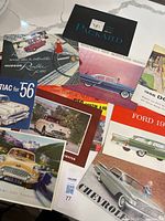 Assorted 1950s car brochures fanned out