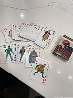 Deck spread showing multiple character cards and box